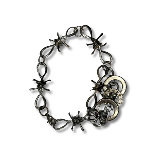 Repurposed fantasy barbed wire chrome bracelet with silver chain layer & three vintage upcycled steampunk style charms